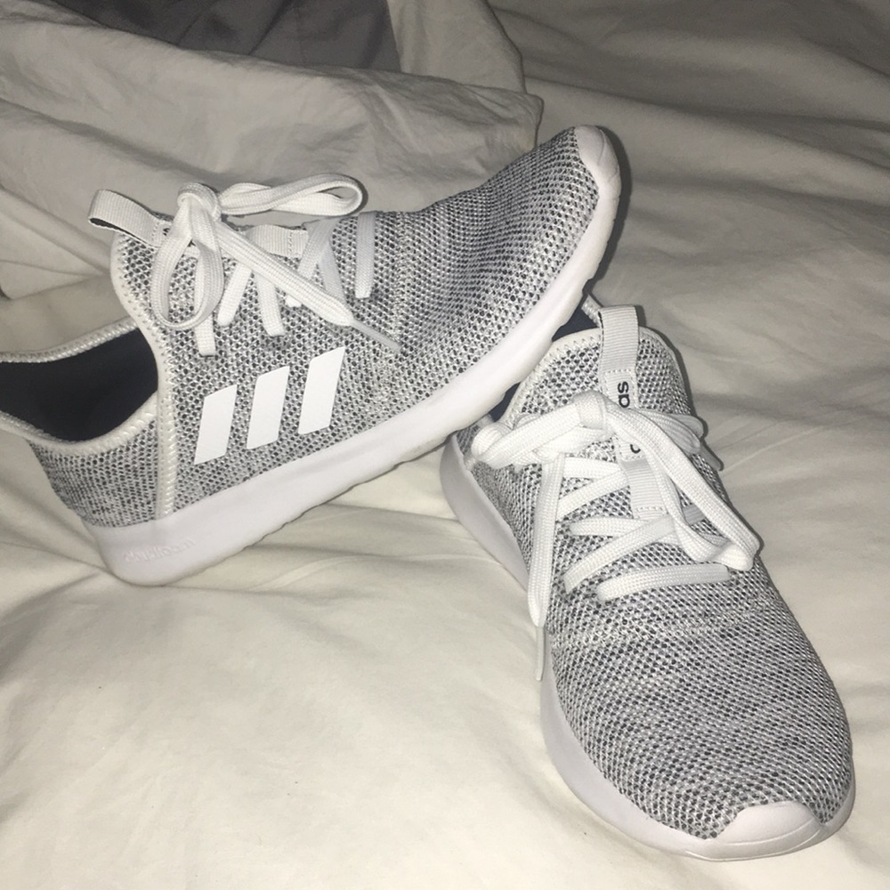 White & black speckled Adidas shoe